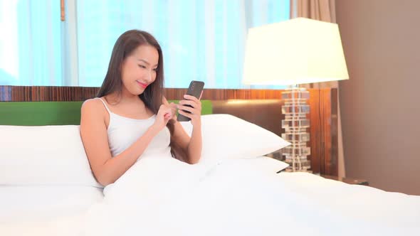 Young asian woman use smart phone