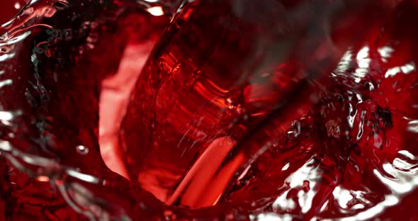 Super Slow Motion Detail Shot of Pouring Red Wine at 1000fps. alt