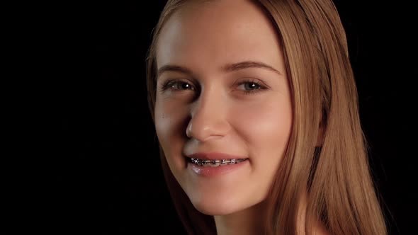 Girl with Braces and Blue Eyes. Black