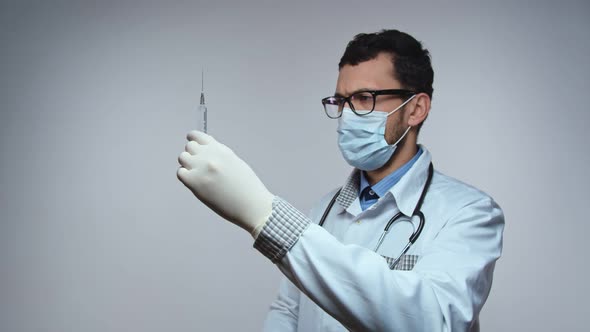 Doctor with Syringe in