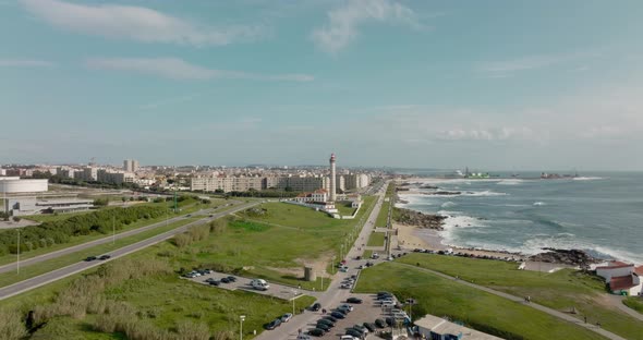 Aerial view over the lighthouse and Capela da Boa Nova in Leça da Palmeira, Matosinhos with the city