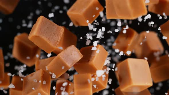 Super Slow Motion Shot of Salted Caramel Explosion Towards Camera Isolated on Black at 1000Fps