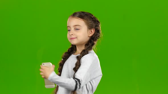 Child Does Selfie. Green Screen