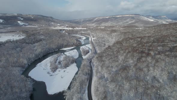 Aerial View of Plateau LagoNaki Mountain Twisted Road in the Winter and Driving Car