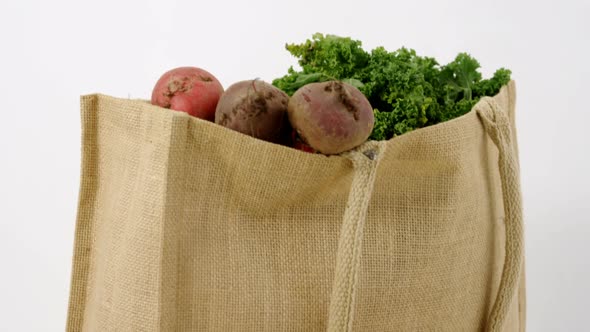 Fresh vegetables and grocery bag on table 4k