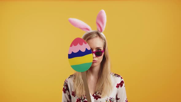 Cool Pretty Blonde European Girl Dressed As Easter Bunny Holding Cardboard Colourful Easter Egg