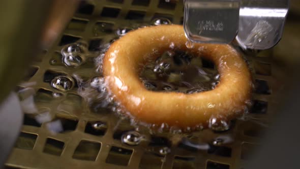 Donuts Frying in Boiling Oil