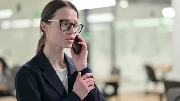 Portrait of Young Businesswoman Talking on Smartphone