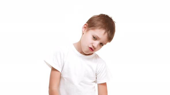 Tired Very Young Caucasian Boy Standing Faded Down on White Background