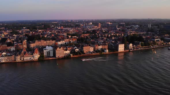 Aerial View Of Boat Sailing At The River And The Beautiful Town Of Dordrecht In Netherlands.