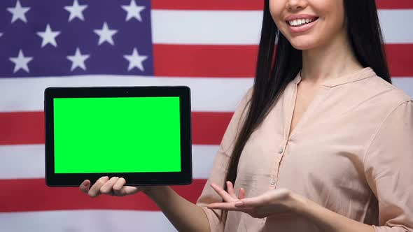 Woman Showing Green Screen Tablet, USA Flag Background, Educational Application