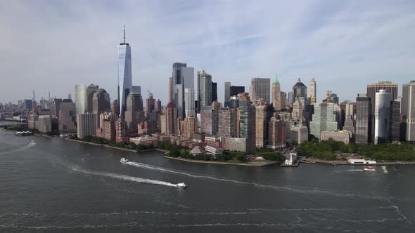 Boats in front of the New York skyline, sunny, summer day in USA - circling Aerial