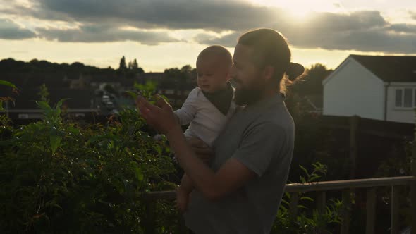 Happy Father Holding Adorable Baby Boy Embracing Kissing