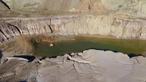 Flying Above Abandoned and Flooded Open Pit Gypsum Quarry