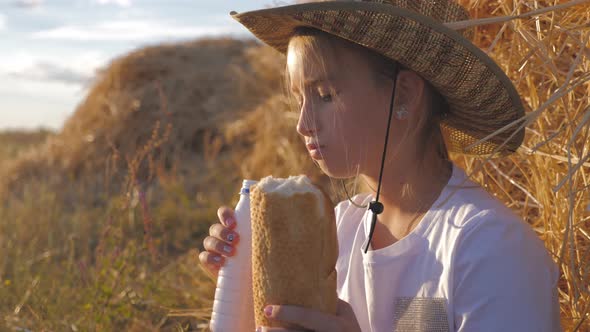 Hungry Child Eating Bread in Wheat Field, Summer Outdoor Lifestyle.