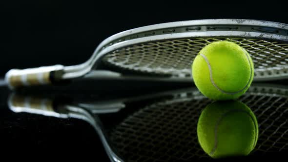 Tennis ball and racket in studio 4k