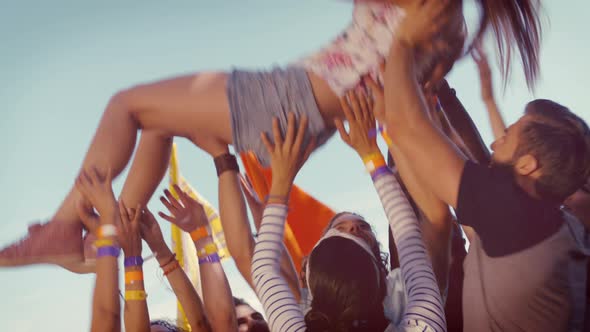 In high quality format happy hipster woman crowd surfing