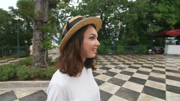 Tourist Woman Standing Under Rain on Antient Building Background on Travel