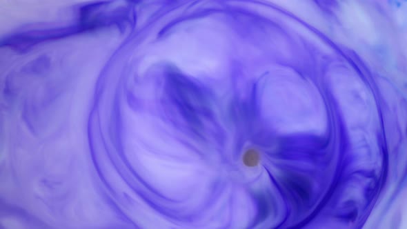Ink in Water. Violet Ink Reacting in Water Creating Abstract Background. alt