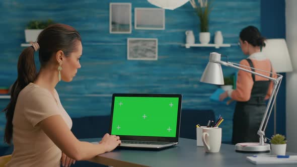 Freelancer Using Computer with Mock Up Green Screen Chroma Key