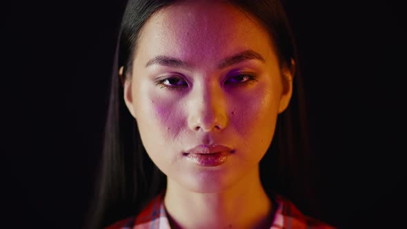 Unedited Shot Of Young Asian Female Face Looking At Camera