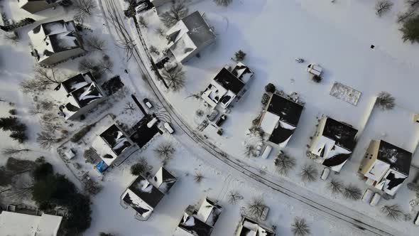 High Altitude View of City with Snow Covered Roofs Houses Neighborhood Town Residential