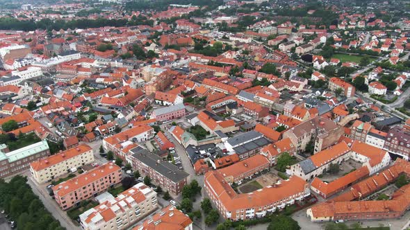 Beautiful old town of city Ystad in Sweden, aerial drone rotate view