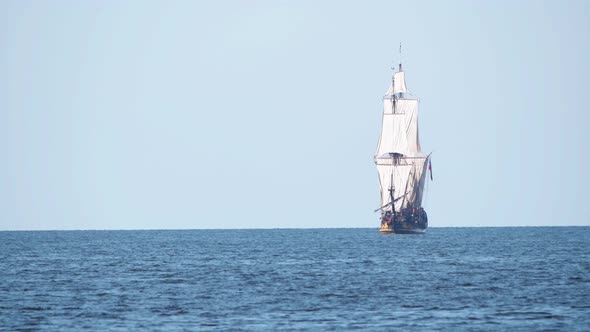 4K - Historical frigate. Sailing ship sails on the sea directly on camera