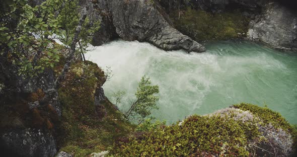 River Flowing Between Cliffs