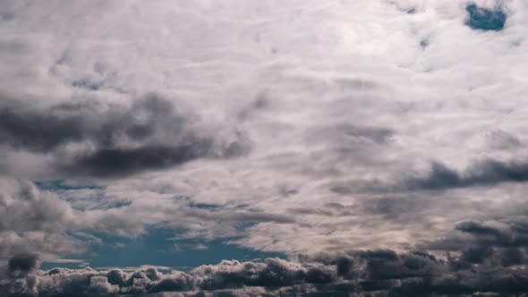 Timelapse of Gray Cumulus Clouds Moves in Blue Dramatic Sky Cirrus Cloud Space