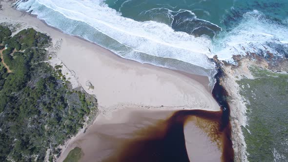 Bird's eye view of lagoon that empties into the ocean on pristine beach, Kleinmond, South Africa