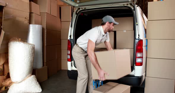 Delivery Driver Packing his Van