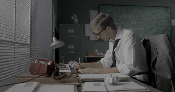 Smart mathematical researcher working in his office