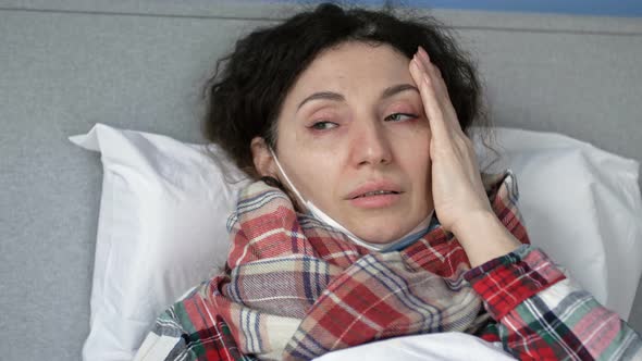 Portrait of a Sick Woman in a Medical Mask with Flu Cold or Coronavirus Symptoms