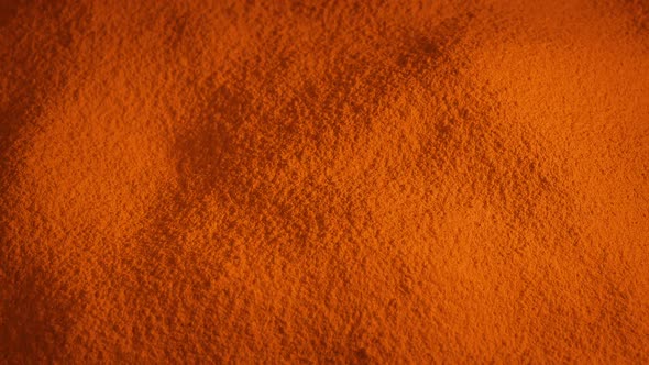 Orange Powder Material Rotating Slowly