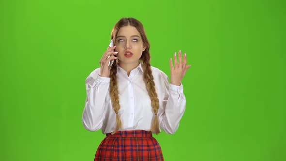 Girl Is Talking on the Phone. Green Screen