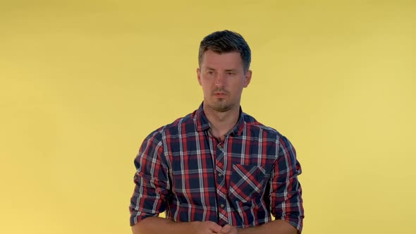 Good-looking Man Counting Something on Finger