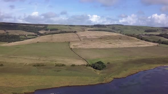 Extremely wide aerial shot centring on the Chapel of St Catherine's near the village of Abbotsbury,