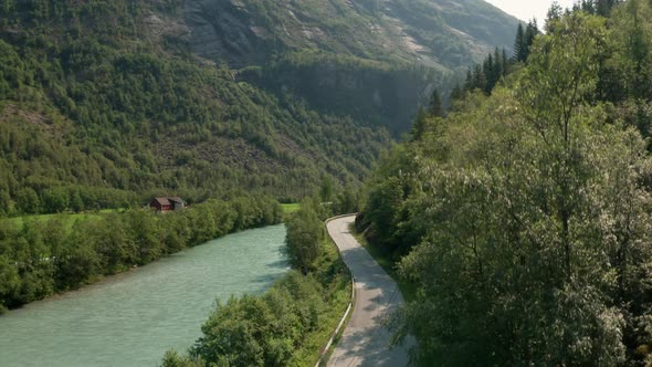 Drone Rising Over River And Road