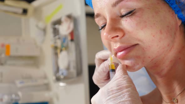 Cosmetologist Making Plasma Injections to Female Face