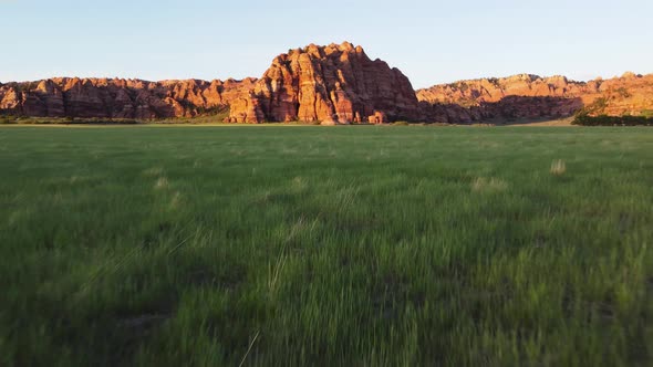 A red rock mountain at sunset in Zion National Park, Utah. Drone shot flying fast