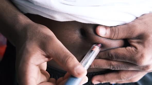 Young Man Hand Using Insulin Pen Close Up