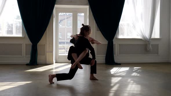 Amazing Shot of Two Contemporary Dancers in Hall Young Man and Woman are Dancing Passionately