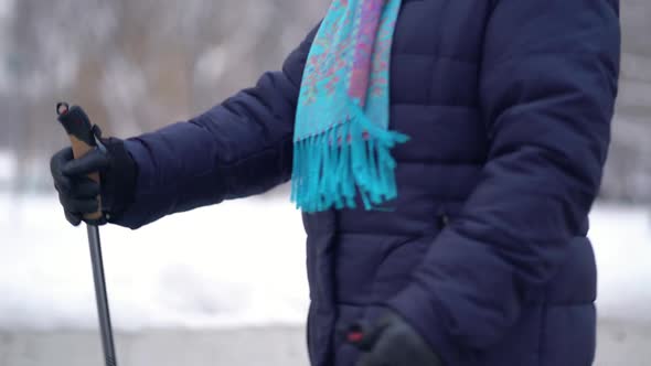 Active Senior Elderly Woman Training Nordic Walking with Trekking Poles. Elderly Woman Practicing