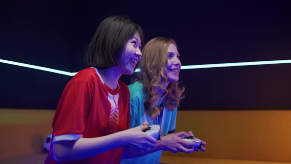 Esports Young Female Gamers Plays a Video Game on a Game Console the Confrontation of Two Players