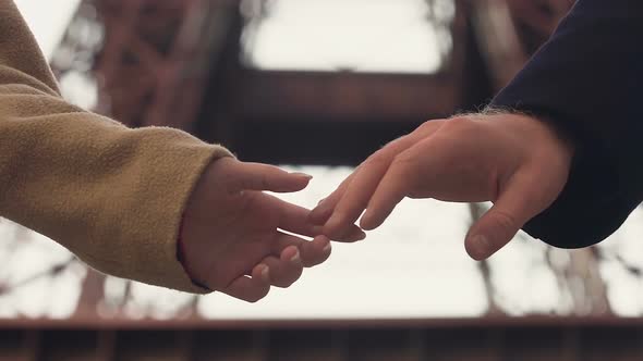 Shy couple holding hands with tender, first date, beginning of love relationship