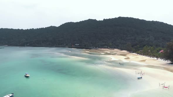 Tropical paradise of Saracen Bay, Koh Rong Samloem. Hammocks on white sand beach