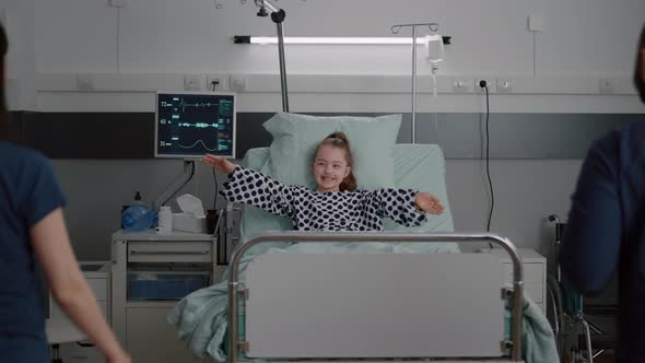 Sick Girl Patient with Oxygen Nasal Tube Resting in Bed Recovering After Surgery