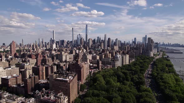 Upper Manhattan cityscape from Hudson river, summer in sunny NY USA - Aerial view