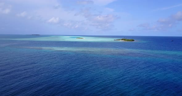 Wide angle above abstract shot of a sunshine white sandy paradise beach and blue ocean background